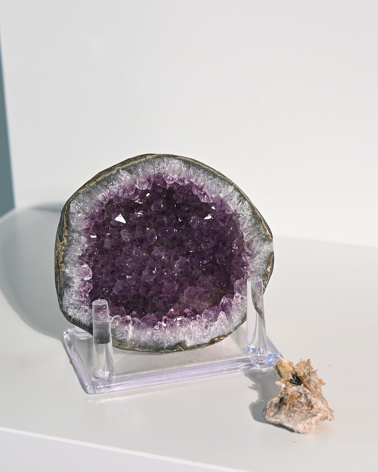 Amethyst Geode w/ Mini Golden Rutile On Stand